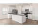 Modern kitchen with white cabinets, granite countertops, and stainless steel appliances at 3266 Maple Ridge Dr, Gastonia, NC 28052