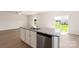 Kitchen with island, granite countertops, stainless steel appliances, and backyard view at 3266 Maple Ridge Dr, Gastonia, NC 28052