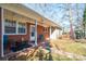 Brick porch with string lights and patio furniture at 408 Elizabeth St, Gastonia, NC 28054