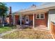 Brick back porch with string lights and seating at 408 Elizabeth St, Gastonia, NC 28054