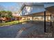 Covered carport with string lights, offering parking and shade at 408 Elizabeth St, Gastonia, NC 28054