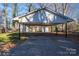 Covered carport provides parking and protection from the elements at 408 Elizabeth St, Gastonia, NC 28054