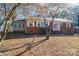 Brick ranch house with a landscaped yard and mature trees at 408 Elizabeth St, Gastonia, NC 28054