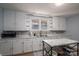 Modern kitchen with white cabinets, marble countertops, and stainless steel appliances at 408 Elizabeth St, Gastonia, NC 28054