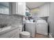 Convenient laundry room with washer, dryer, and additional storage at 408 Elizabeth St, Gastonia, NC 28054
