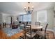 Bright living room featuring hardwood floors, a cozy seating area, and ample natural light at 408 Elizabeth St, Gastonia, NC 28054
