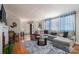 Open living room featuring a gray sectional sofa at 408 Elizabeth St, Gastonia, NC 28054