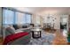 Spacious living area with gray sectional sofa and hardwood floors at 408 Elizabeth St, Gastonia, NC 28054