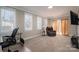 Home office with large windows, comfortable seating, and workspace at 408 Elizabeth St, Gastonia, NC 28054