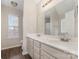 Bathroom with double vanity and large mirror at 5110 Osage Cir, Charlotte, NC 28269