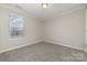 Spacious bedroom with window and carpet at 5110 Osage Cir, Charlotte, NC 28269