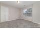 Bedroom with double door closet and carpet at 5110 Osage Cir, Charlotte, NC 28269