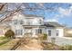 Two-story house with white siding, gray roof, and landscaping at 5110 Osage Cir, Charlotte, NC 28269