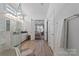 Bright bathroom with double vanity, walk-in shower, and bedroom access at 82112 Standing Oak Dr, Charlotte, NC 28278