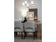 Modern dining area with light-toned wood table and chairs at 82112 Standing Oak Dr, Charlotte, NC 28278