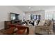 Spacious living area with comfortable seating and access to patio at 82112 Standing Oak Dr, Charlotte, NC 28278