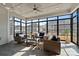 Relaxing sunroom with wicker furniture and large windows offering scenic views at 82112 Standing Oak Dr, Charlotte, NC 28278
