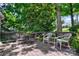 Outdoor deck with seating surrounded by lush green trees providing a serene outdoor space for relaxing and entertaining at 92 Heritage Dr, Clover, SC 29710