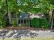 Exterior view of the house surrounded by lush trees and greenery offering a private and scenic residential setting at 92 Heritage Dr, Clover, SC 29710