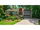 Gray house with stone steps, landscaping, and a two-car garage at 92 Heritage Dr, Clover, SC 29710