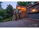 Charming home exterior at dusk with glowing lights and an inviting entrance creates an appealing nighttime ambiance at 92 Heritage Dr, Clover, SC 29710