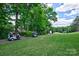 A golf course view showing lush green grass and fairways, highlighting recreational amenities near a residential area at 92 Heritage Dr, Clover, SC 29710