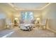 This living room is brightly lit with recessed lights and features a lovely window and seating area with plush chairs at 92 Heritage Dr, Clover, SC 29710