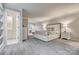Spacious main bedroom features plush carpet, ensuite bath, and bright sunny sitting area at 92 Heritage Dr, Clover, SC 29710
