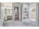 Large primary suite with ensuite bathrooms, vanity area, and shelving for personal items at 92 Heritage Dr, Clover, SC 29710