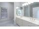 Elegant bathroom with double vanity, large mirror, and a separate shower and tub at 9451 Bonnie Briar Cir, Charlotte, NC 28277