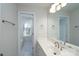 Simple bathroom with single vanity and a tub/shower combo at 9451 Bonnie Briar Cir, Charlotte, NC 28277