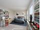 Virtually staged bedroom with a bed, desk, and decorative elements at 9451 Bonnie Briar Cir, Charlotte, NC 28277