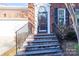 Brick front steps leading to the home's entrance with black railings at 9451 Bonnie Briar Cir, Charlotte, NC 28277