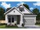 Charming craftsman style home with gray siding and stone accents at 1031 Bourn Ln, Waxhaw, NC 28173