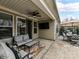 Relaxing patio with seating area and outdoor TV at 10409 Paper Birch Dr, Charlotte, NC 28215