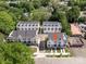 Aerial view showcasing modern townhomes with private driveways and manicured landscaping at 1225 E 34Th St # Csw0419, Charlotte, NC 28205