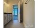 Bathroom with vanity, tile floor, and access to bedroom at 1225 E 34Th St # Csw0419, Charlotte, NC 28205