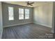 Spacious bedroom with hardwood floors and large windows at 1225 E 34Th St # Csw0419, Charlotte, NC 28205