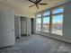 Spacious bedroom with large windows, carpet, and closet space at 1225 E 34Th St # Csw0419, Charlotte, NC 28205