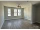 Bright and airy bedroom with hardwood floors and ceiling fan at 1225 E 34Th St # Csw0419, Charlotte, NC 28205