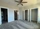 Bright bedroom with carpet, ceiling fan, and ample closet space at 1225 E 34Th St # Csw0419, Charlotte, NC 28205