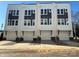 Three-unit townhome building with modern design and attached garages at 1225 E 34Th St # Csw0419, Charlotte, NC 28205