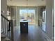 Modern kitchen with island, stainless steel appliances, and large windows at 1225 E 34Th St # Csw0419, Charlotte, NC 28205