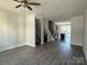 Spacious living room with hardwood floors and ceiling fan at 1225 E 34Th St # Csw0419, Charlotte, NC 28205