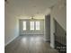 Bright living room with hardwood floors and lots of natural light at 1225 E 34Th St # Csw0419, Charlotte, NC 28205