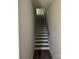 Modern staircase leading to upper levels of the townhome at 1225 E 34Th St # Csw0419, Charlotte, NC 28205