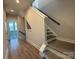 Modern staircase with grey steps and neutral walls at 1225 E 34Th St # Csw0419, Charlotte, NC 28205