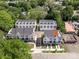 Aerial view of townhomes showcasing architectural style, landscaping, and surrounding community at 1227 E 34Th St # Csw0420, Charlotte, NC 28205