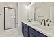 This bathroom offers double sinks and walk-in shower at 1227 E 34Th St # Csw0420, Charlotte, NC 28205