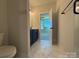 This bathroom includes a vanity with blue cabinets at 1227 E 34Th St # Csw0420, Charlotte, NC 28205